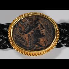 Bracelet or et cuir avec pice en bronze